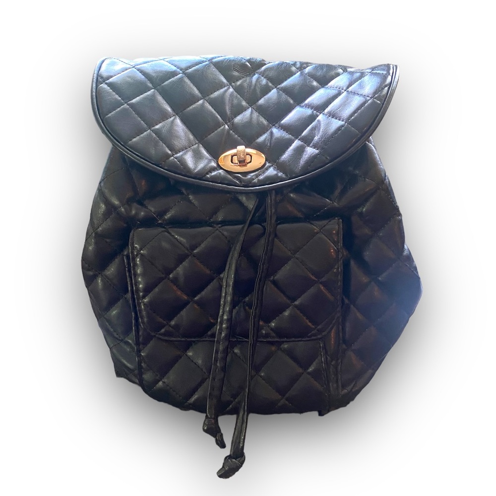 Quilted backpack with gold chain straps